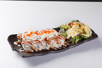 Fresh salmon sushi roll with sauce on white plate © Donghyun Kim