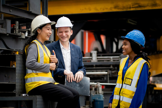 Industrial leadership and factory inspection. Engineers and managers review production operations on a manufacturing platform. Leadership, inspection, industry, teamwork, manufacturing