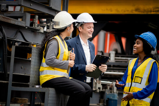 Industrial leadership and factory inspection. Engineers and managers review production operations on a manufacturing platform. Leadership, inspection, industry, teamwork, manufacturing