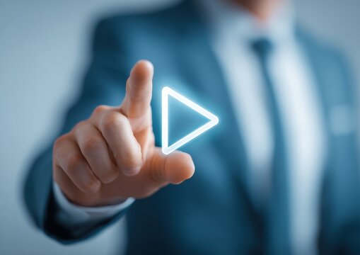 Businessman interacting with glowing digital play media icon on virtual touchscreen interface businessman touchscreen technology interface business multimedia innovation corporate