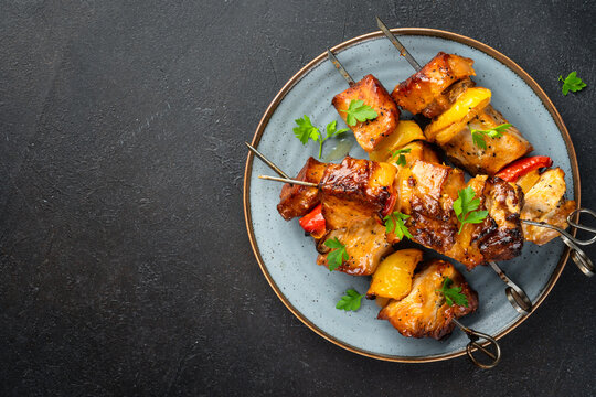 Grilled shish kebab or meat skewers with vegetables.