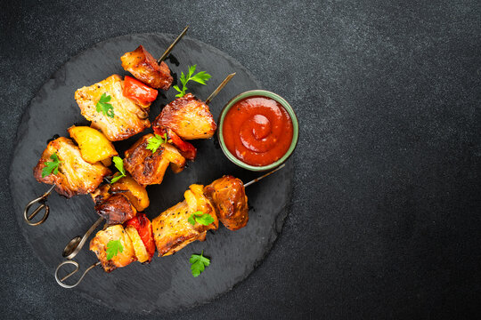 Grilled shish kebab or meat skewers with vegetables.