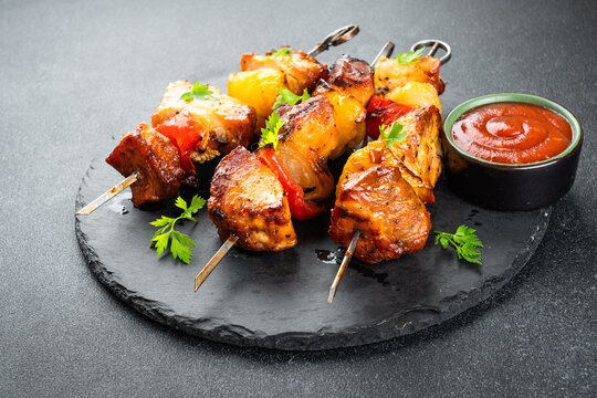 Grilled shish kebab, Grilled meat skewers on black.