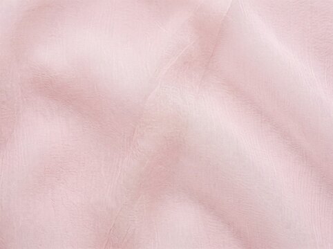 Soft pink chiffon fabric texture background with fabric delicate folds displays close view sheer woven texture close up material