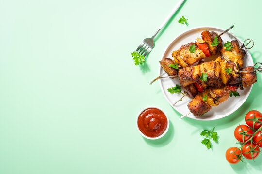 Grilled shish kebab or meat skewers with vegetables.