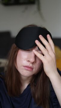 Vertical screen Morning fatigue leaves a young woman drained and unfocused showing how exhaustion low energy and poor sleep can make every new day harder to start