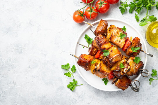 Grilled shish kebab or meat skewers with vegetables.