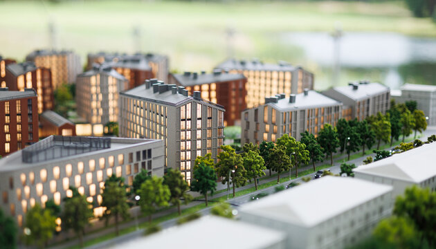 Model of a residential area with buildings and trees near a water body