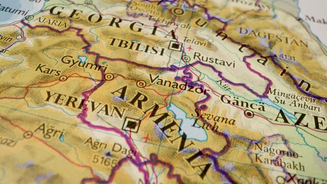 armenia to georgia travel route on paper map with gliding camera view