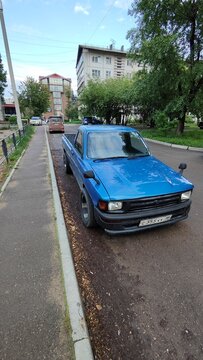 Irkutsk, Russia - June 12, 2026. Blue Toyota Hilux Pickup Track