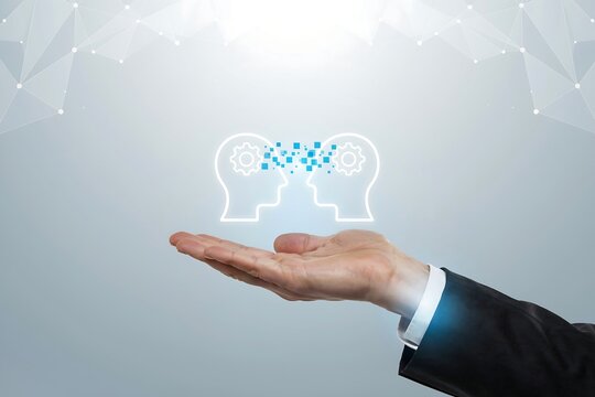 Business professional holding a digital human head icon representing knowledge sharing ideas