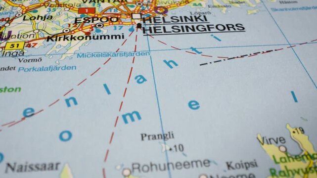 Gliding over the Gulf of Finland from Helsinki to Tallinn on an atlas map
