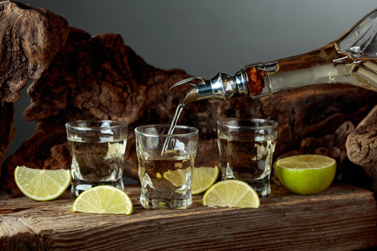 Tequila with salt and lime slices.