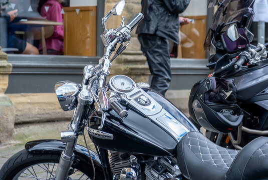 Alnwick, Northumberland, UK - June 20 2026. A close view of the front end of a classic and vintage Harley Davidson motorcycle, highlighting its timeless retro styling.