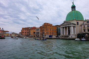 Ambiance and atmosphere in Venice with canals, boats, water taxi, gondola and colorful buildings  © PaBou