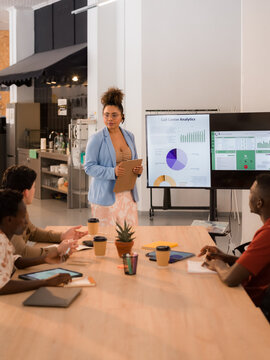 Group Discusses Business Data in Meeting Room