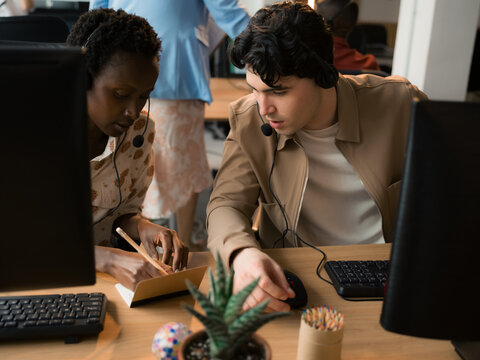 People Work Together in an Office Environment During the Day