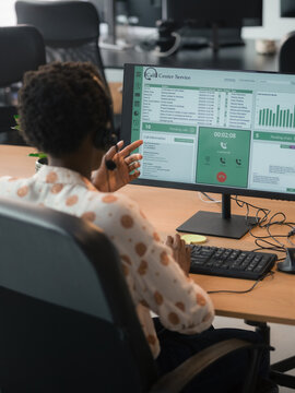 Call Center Worker Engaged in Customer Service Communication at Office
