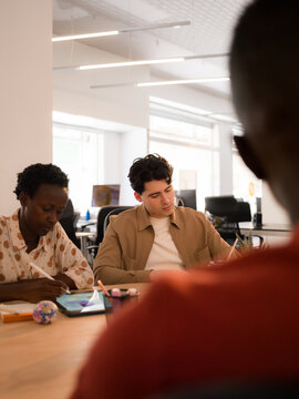 People taking notes during meeting at office 