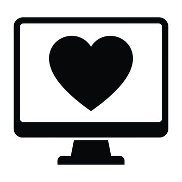Computer monitor screen with a heart symbol icon representing love and tech care