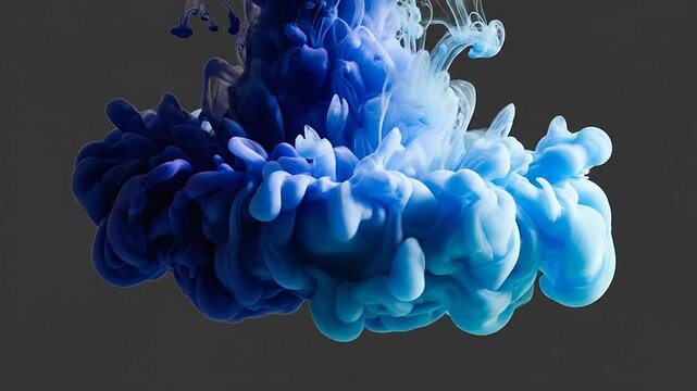 Blue and cyan ink cluster on grey background.