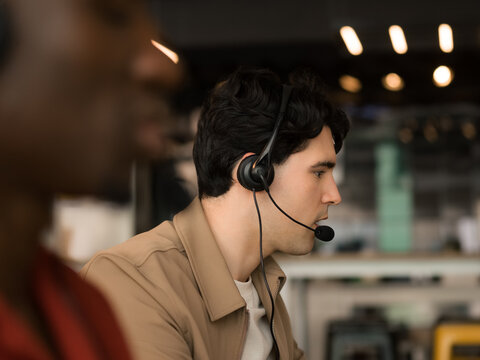Customer Service Agents Assist Clients at a Busy Call Center