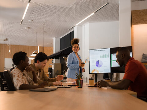 Team Works Together on Project in Office During Daytime Meeting