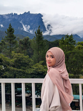Portrait of a young women with Mt Kinabalu background Kundasang Sabah Malaysia