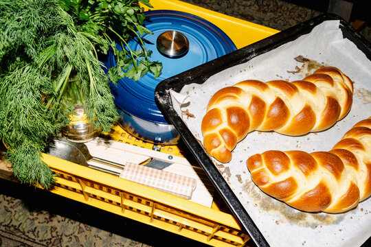 Private chef catering basket with fresh challah and herbs