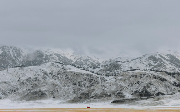 Winter Prairie, Mountains, and Red Cabin.