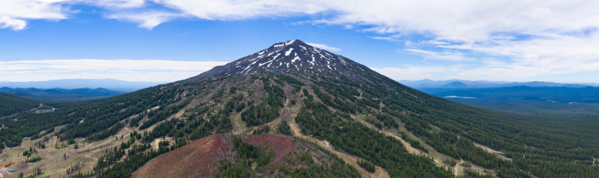 Mt. Bachelor and its meandering ski trails rise from the Deschutes National Forest in Oregon. This iconic volcanic mountain is part of the Cascade Range and just 22 miles from Bend.