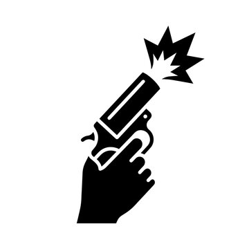 Starting pistol held by a hand firing in a sporting event with competition