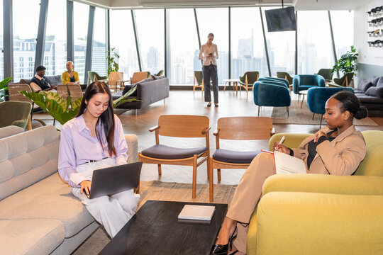 Business Meeting in a Spacious Office Setting With City View