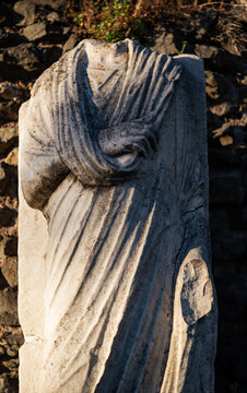 Headless ancient Roman marble statue along the Appian Way in Rome 