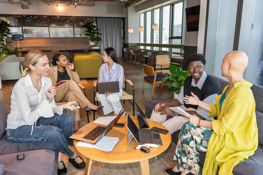 Group of People Meeting in an Office Space During the Day