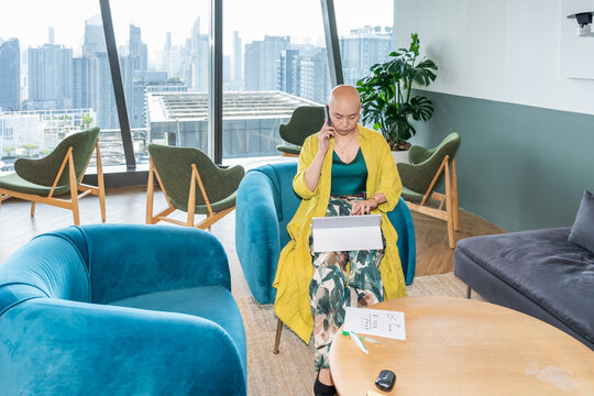 Woman Working Inside a Modern Office Space With City View