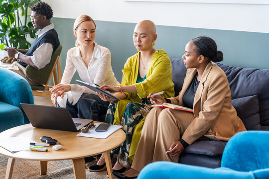 Team Members Discuss Ideas in a Modern Office Setting