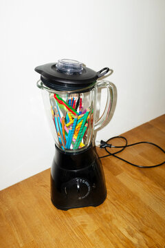 Conceptual image of blender filled with art drawing colour pencils