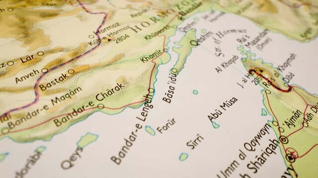strait of hormuz on detailed atlas map, gliding close up over