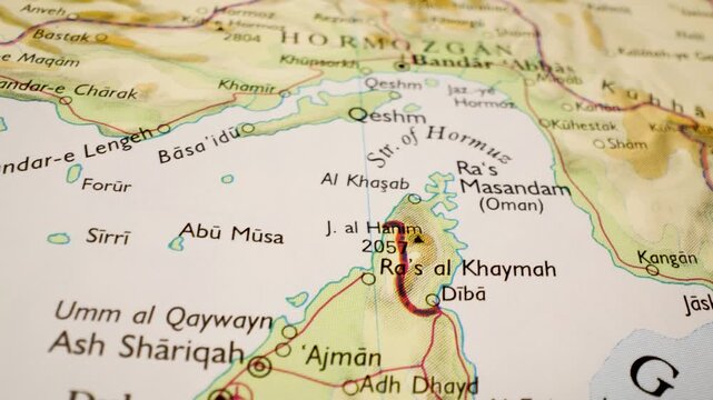 strait of hormuz on detailed atlas map, gliding close up over