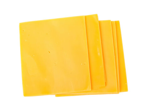 Stacked yellow cheddar cheese slices food ingredient
