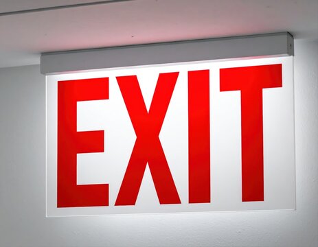 Illuminated red exit sign indicating emergency safety way