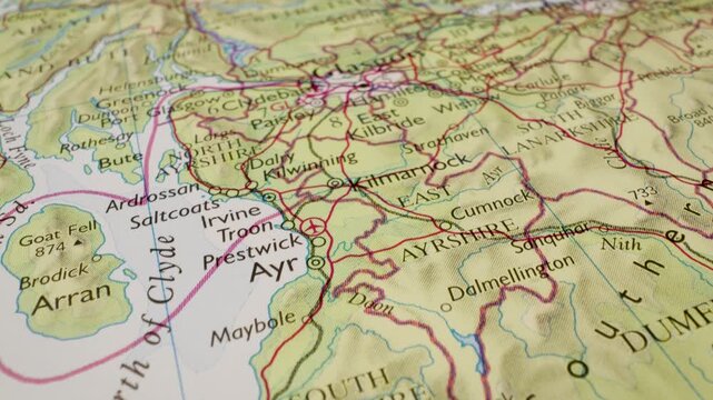 destination glasgow, scotland, aerial glide across atlas map