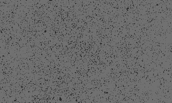 Close up gray concrete texture with irregular dark speckles, mottled terrazzo like surface background for architectural finishes, overlays