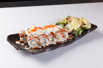 Fresh salmon sushi roll with sauce on white plate © Donghyun Kim