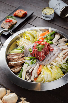 Korean hot pot jeongol with meat vegetables and rice cake in lar