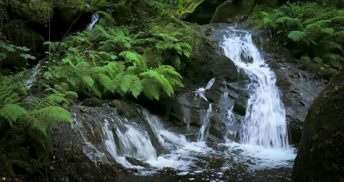 View of an idyllic waterfall on the River Edo in Castro Caldelas, Ourense, Galicia, Spain