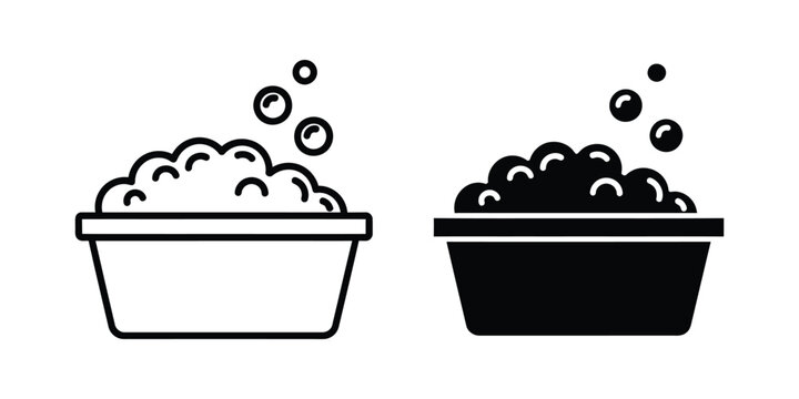 Set of laundry basin icons with soap bubbles and foam in outline and solid black styles for cleaning and hygiene concepts