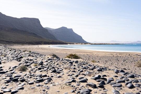 Playa de las Conchas beach, La Graciosa island panorama showcasing sandy shore and volcanic mountains