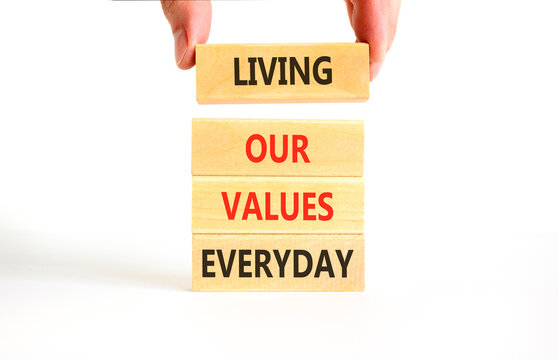Living our values everyday words symbol. Concept words Living our values everyday on beautiful wooden blocks. Beautiful white background. Business living our values everyday concept. Copy space.